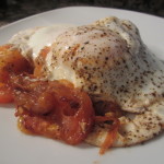 Cooked eggs and tomato