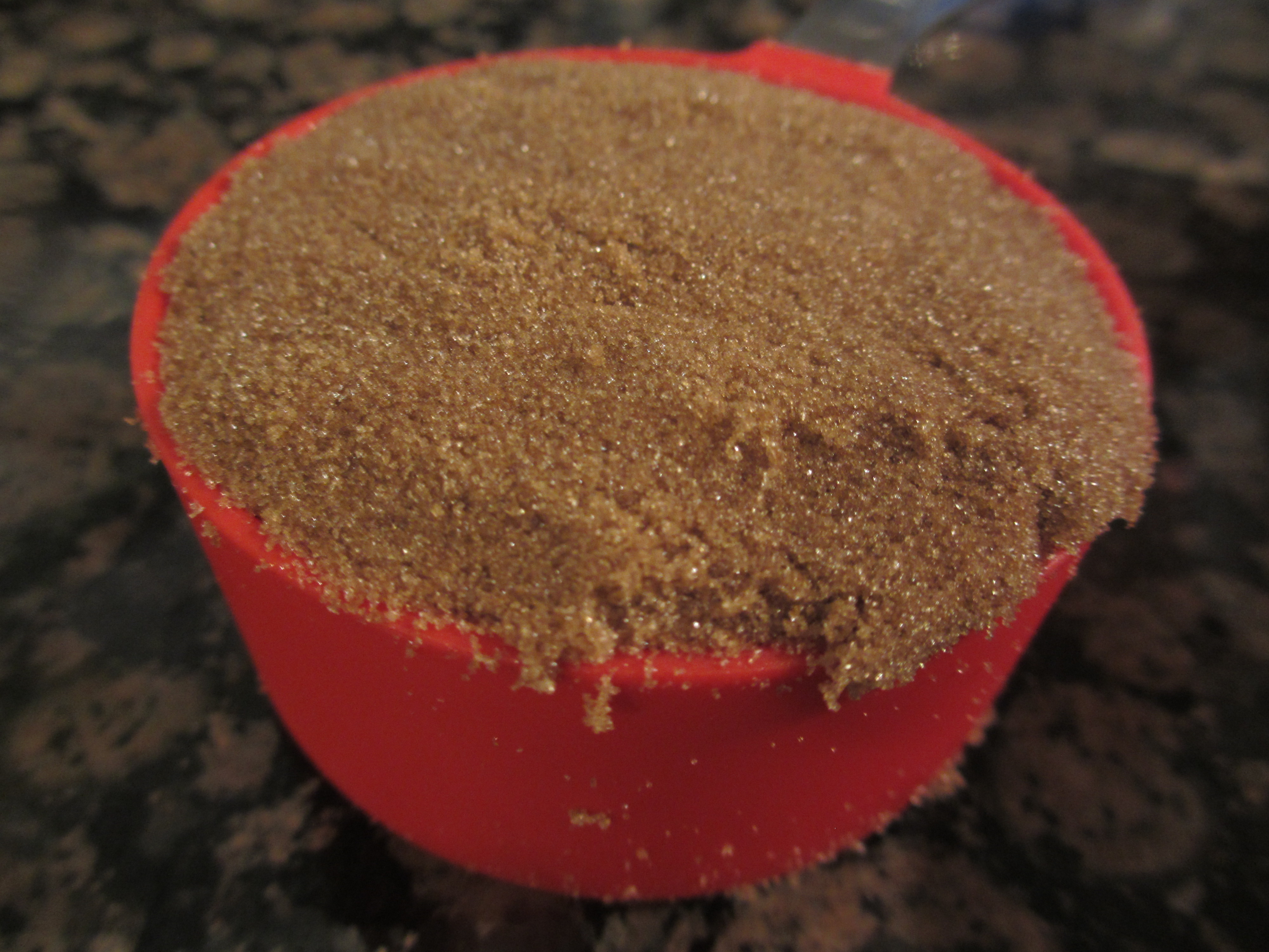 Brown sugar in a measuring cup