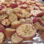 Sliced potatoes, seasoned with herbs and tossed in olive oil
