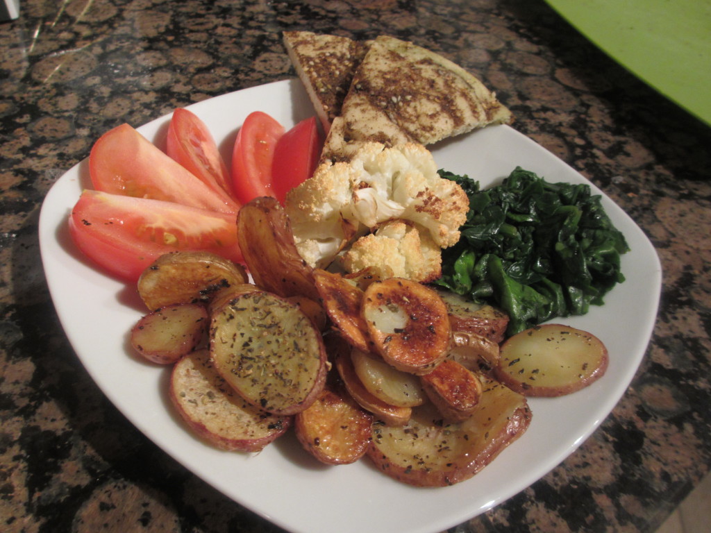 Bread, tomatoes, spinach, potatoes, and cauliflower