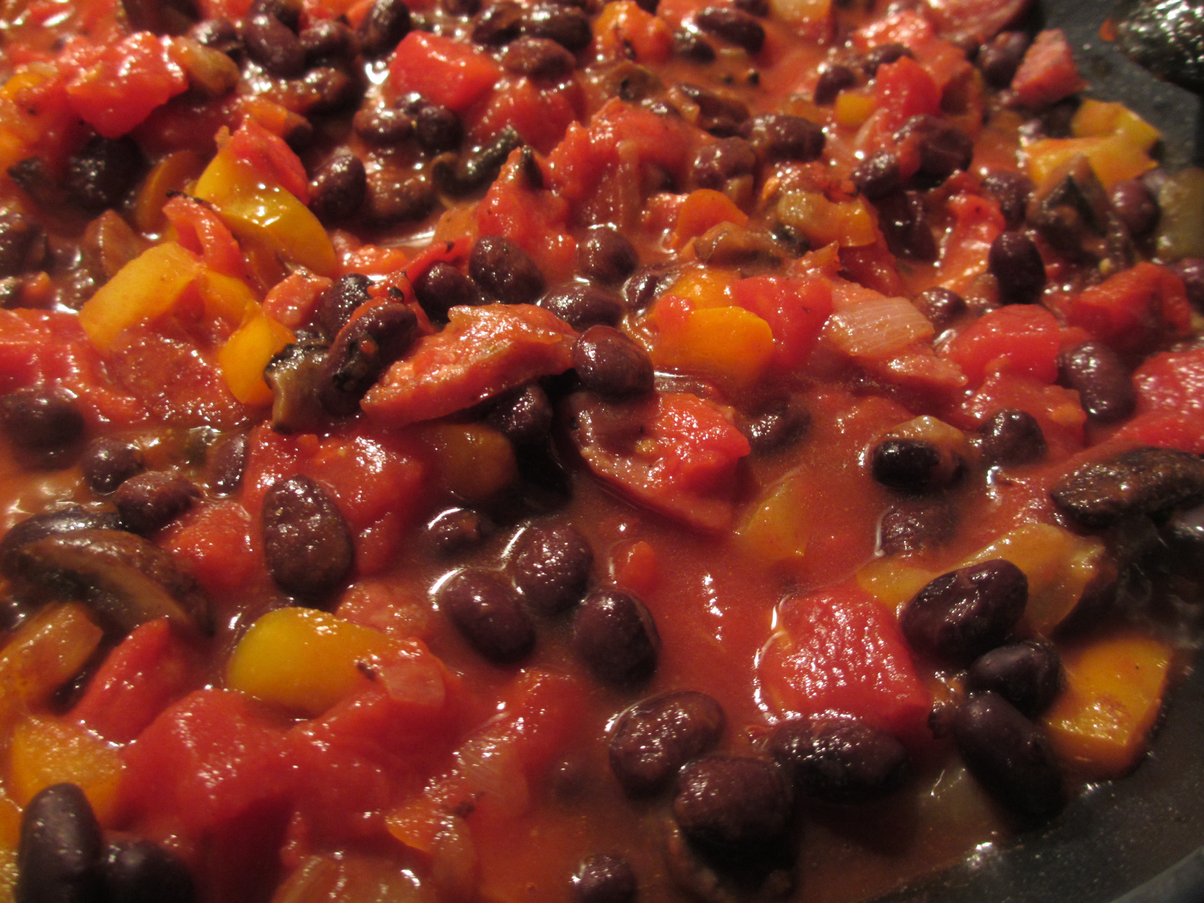 Chopped color peppers with sausage, black beans, and diced tomatoes