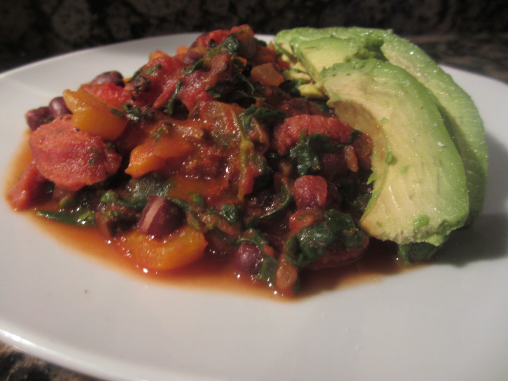 Cooked beans, peppers, onions, sausage, and diced tomatoes with avocado