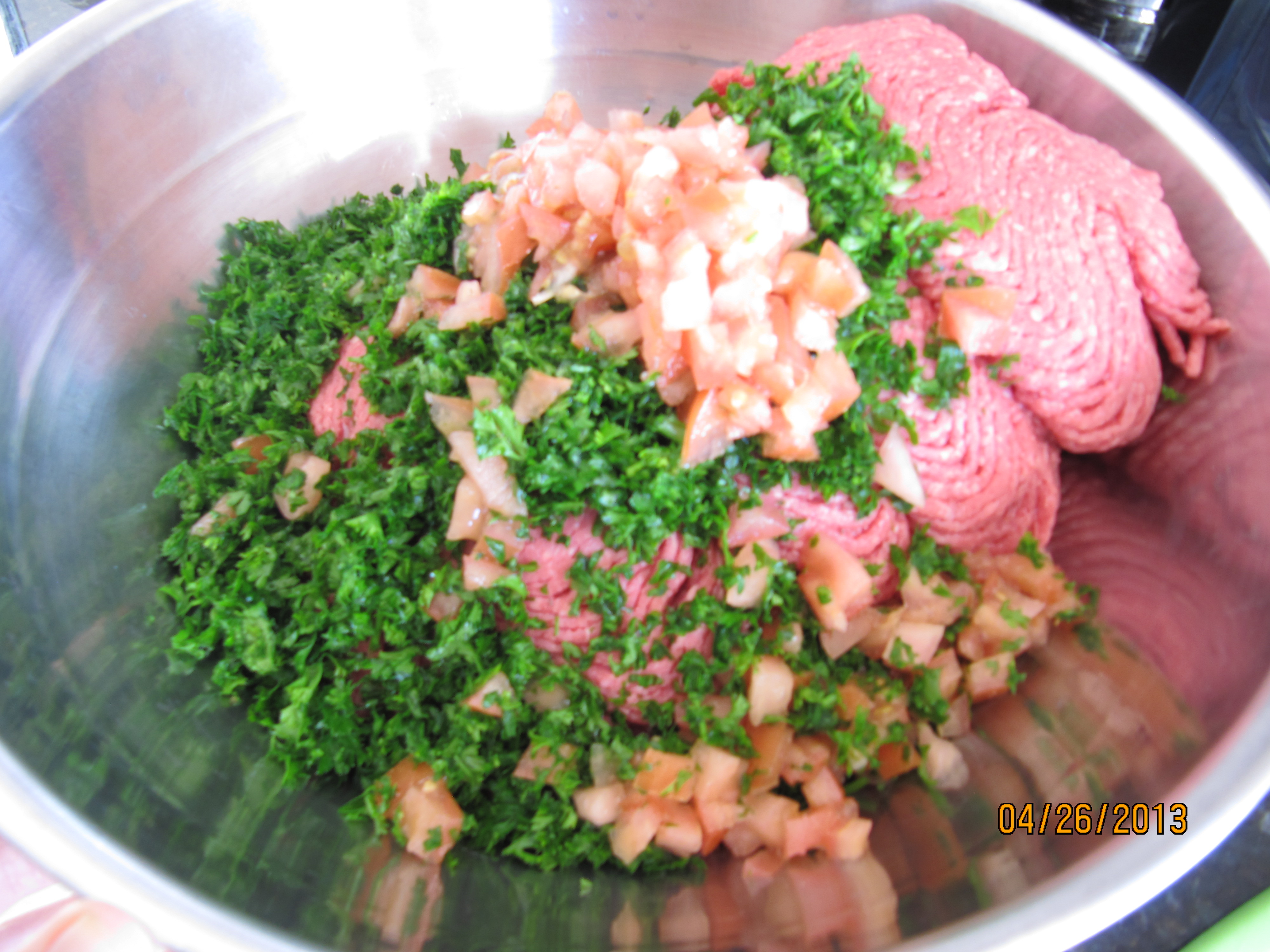Chopped tomatoes, parsley, and ground meat