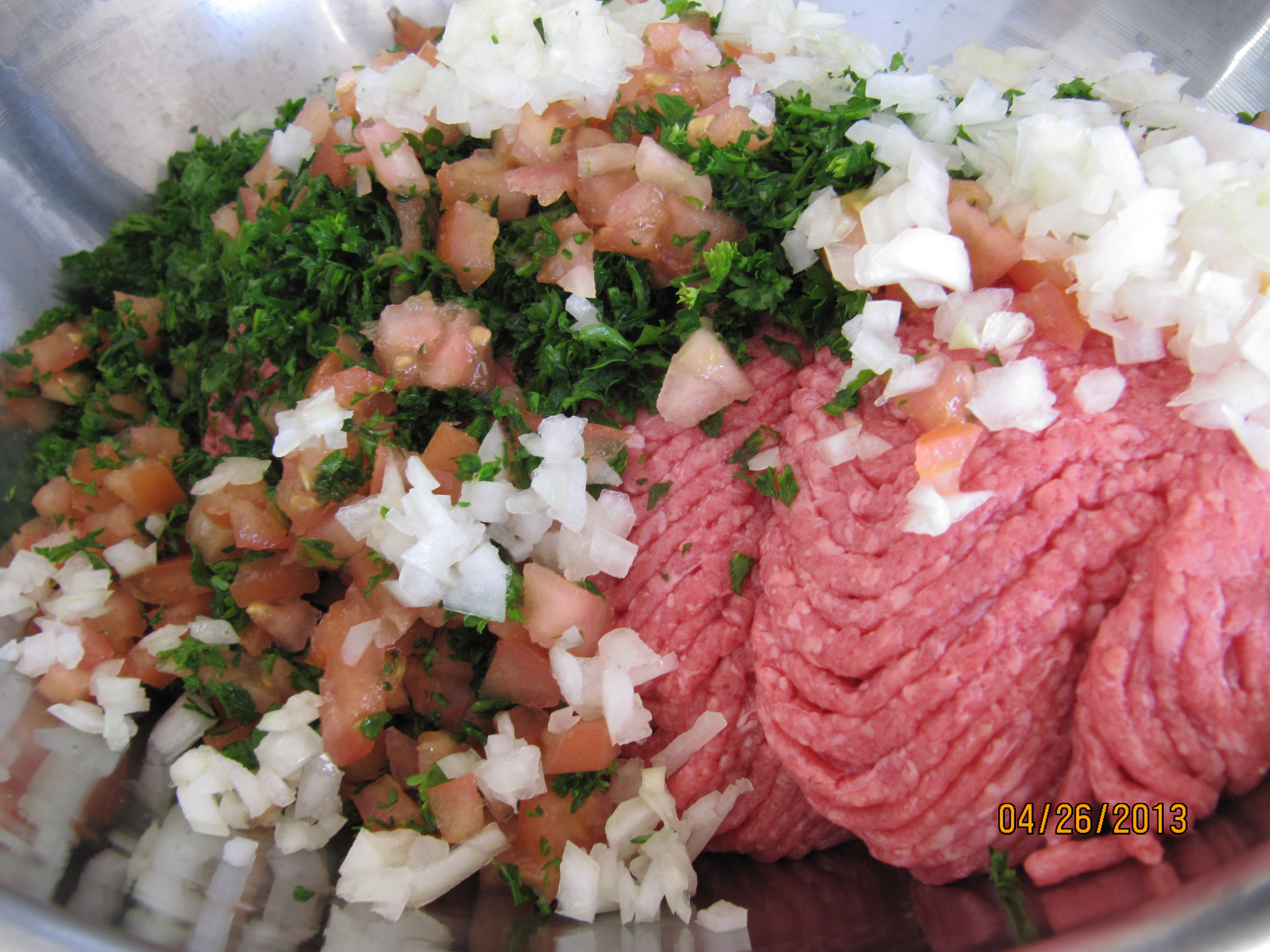 Chopped tomatoes, parsley, and ground meat