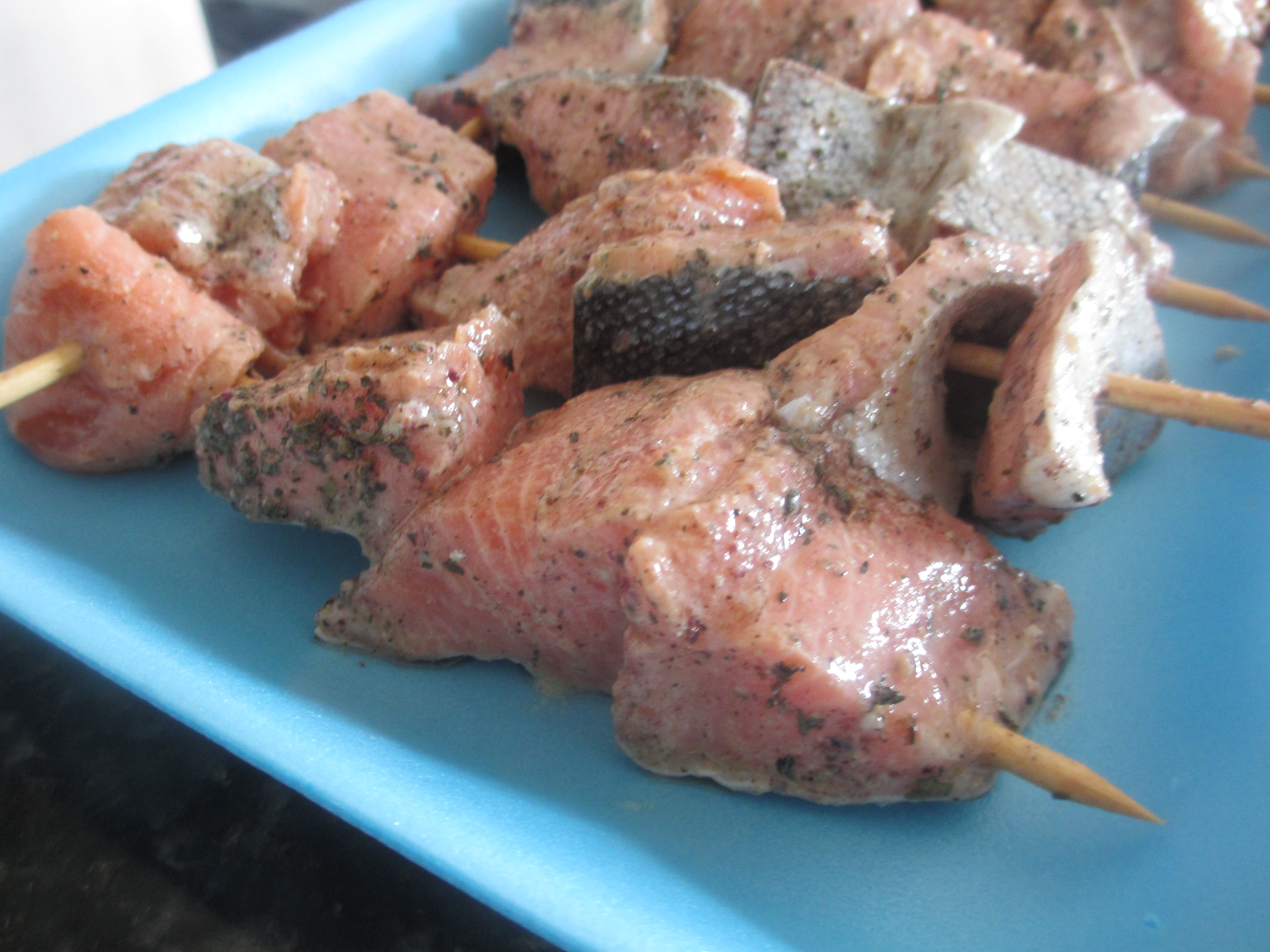 Chopped salmon chunks on a skewer