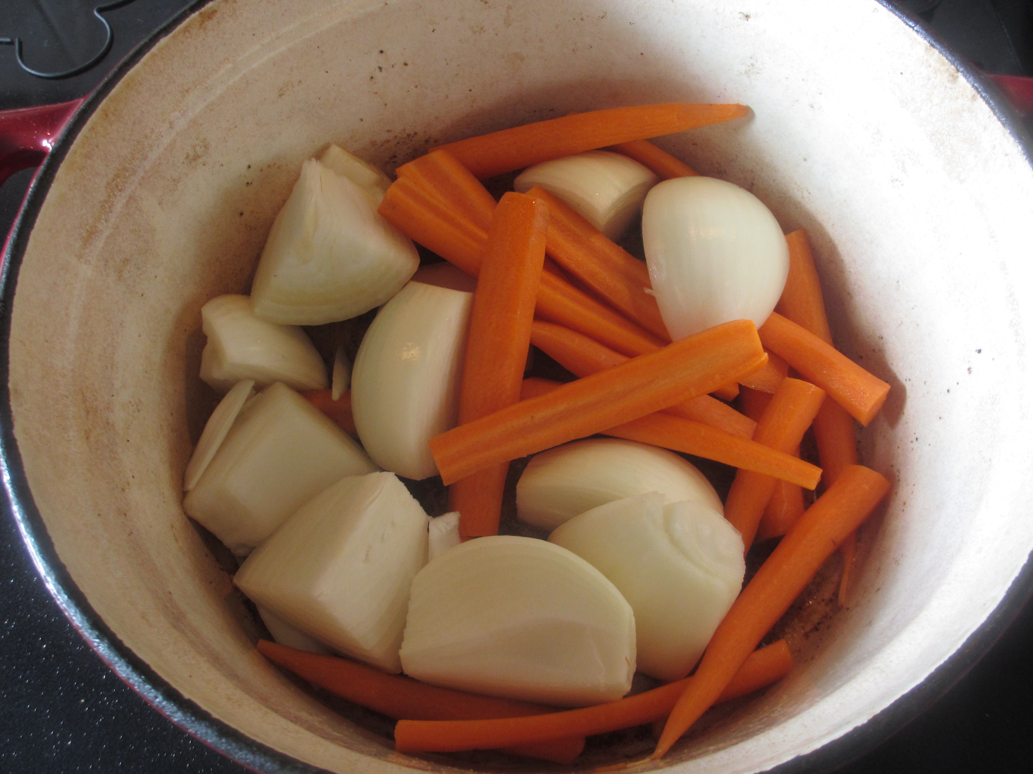 Carrots and onions in a pot