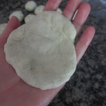 Dough open in the palm of a hand