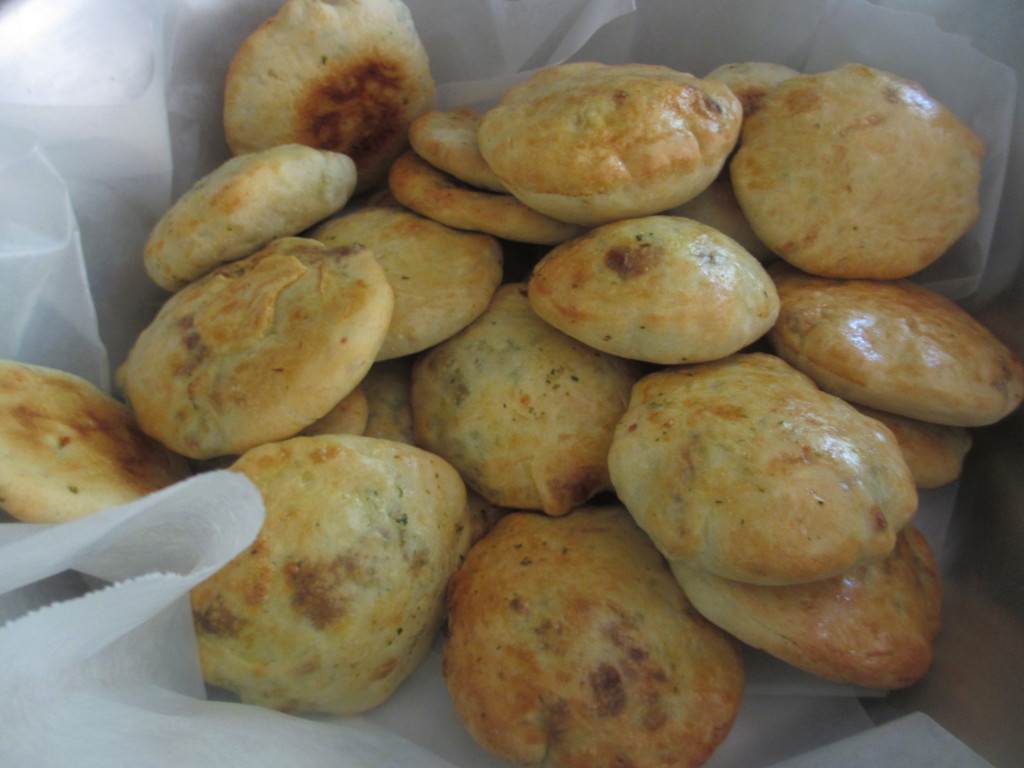 A bowl of hot cheese pies
