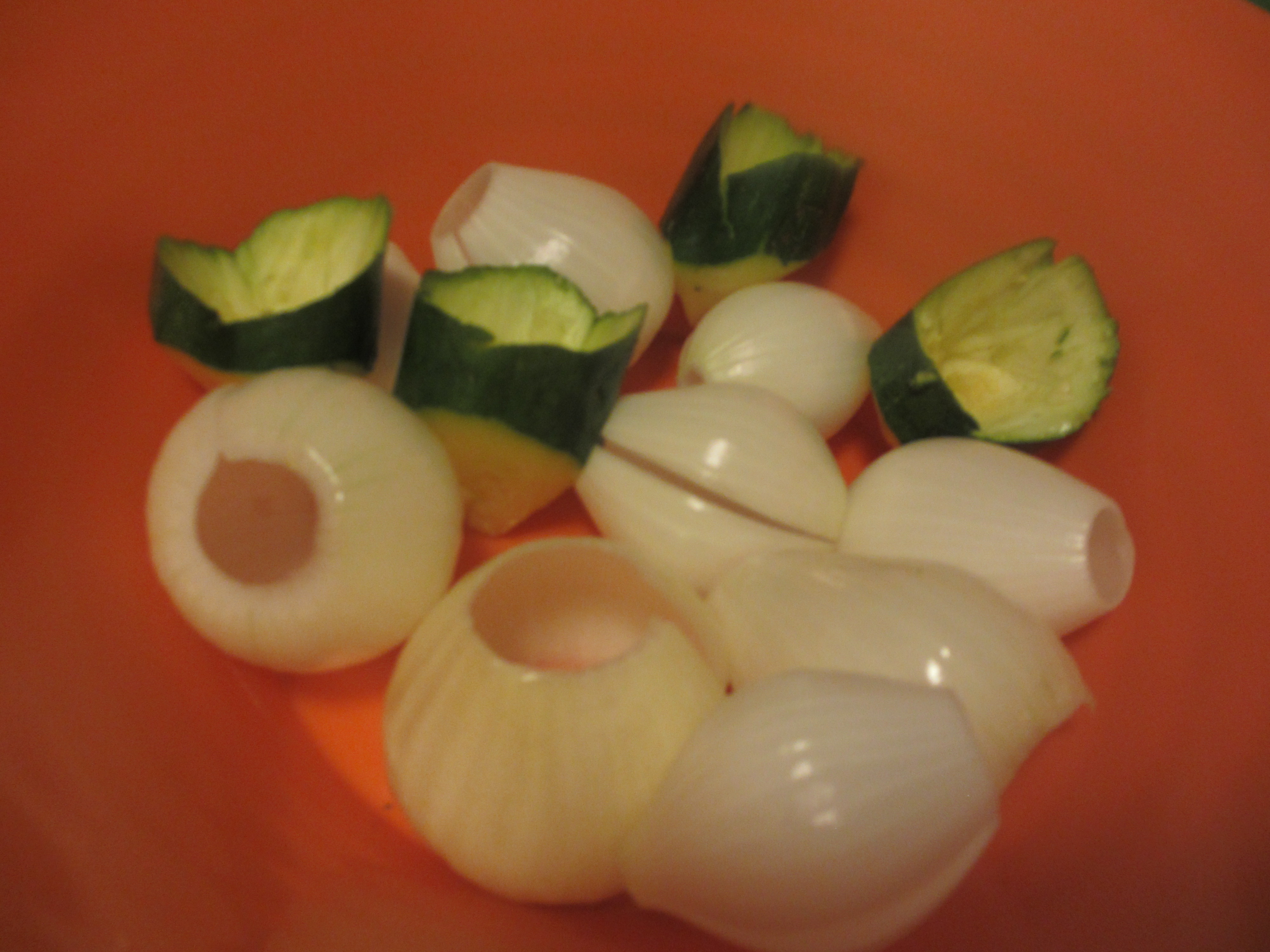 Peeled onions and sliced zucchini