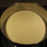 Milk in a pot. Looks yellowish because of the lighting