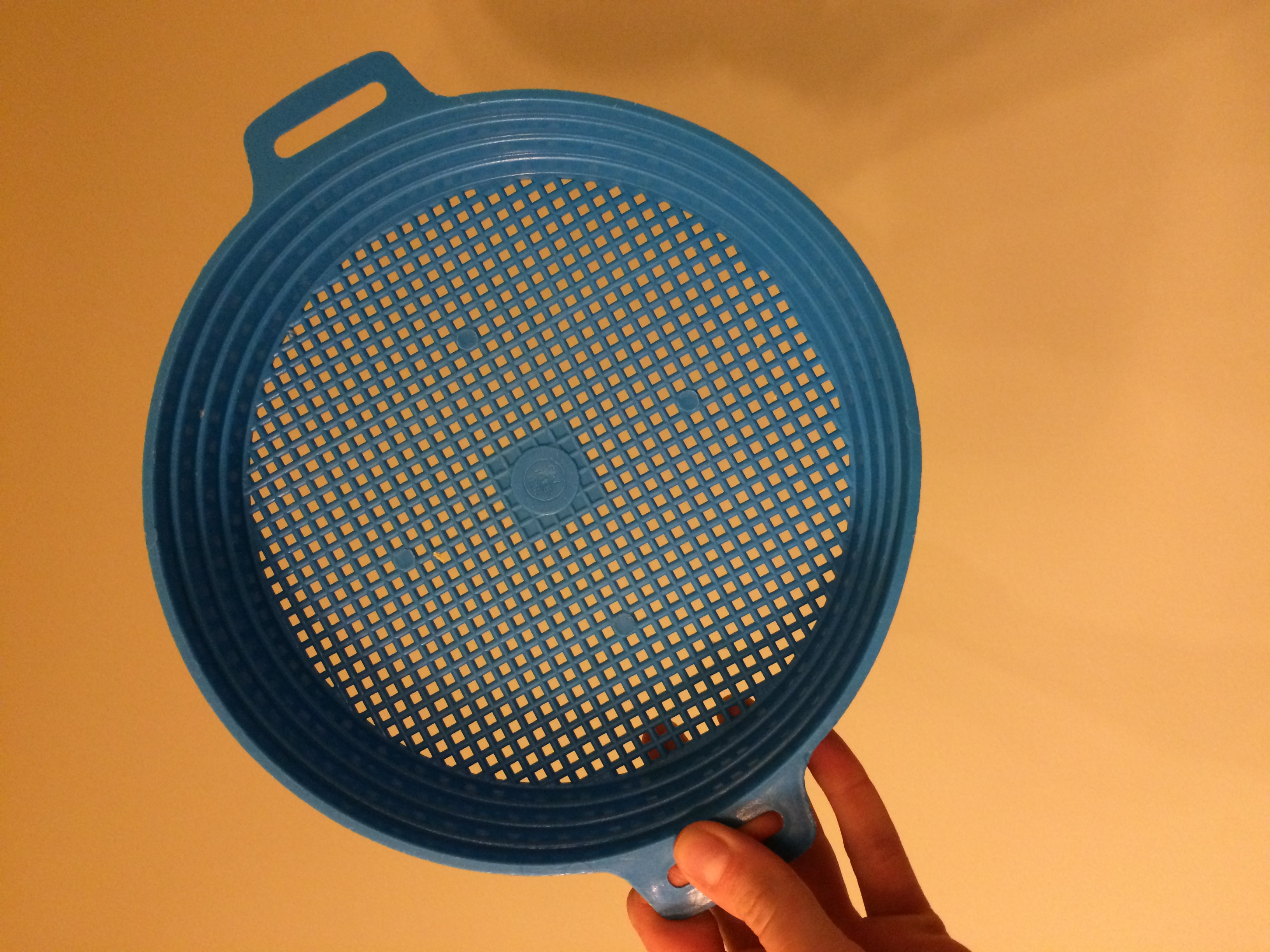 Plastic strainer used to strain the curds from whey