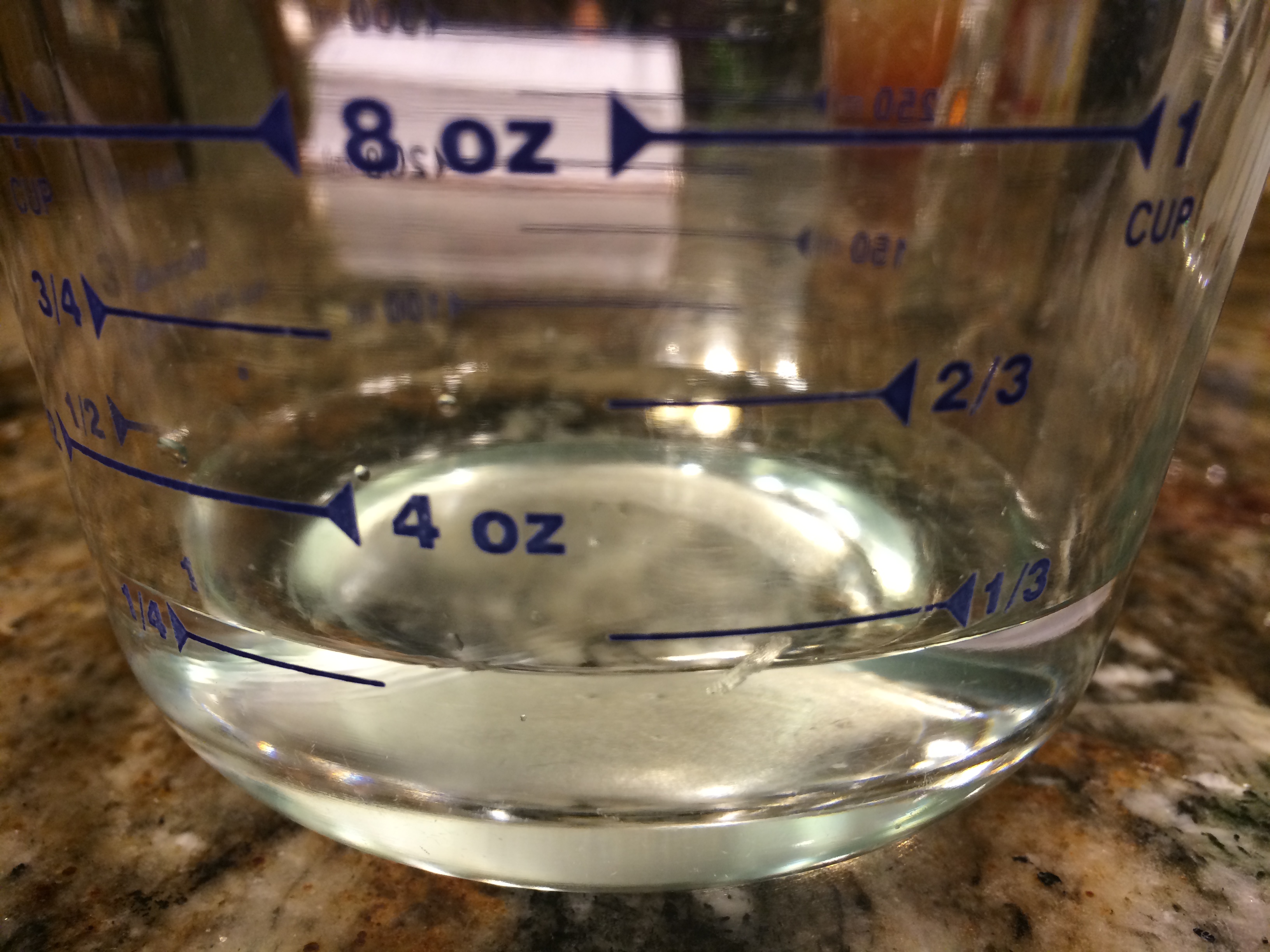 1/3 cup of vinegar in a measuring glass