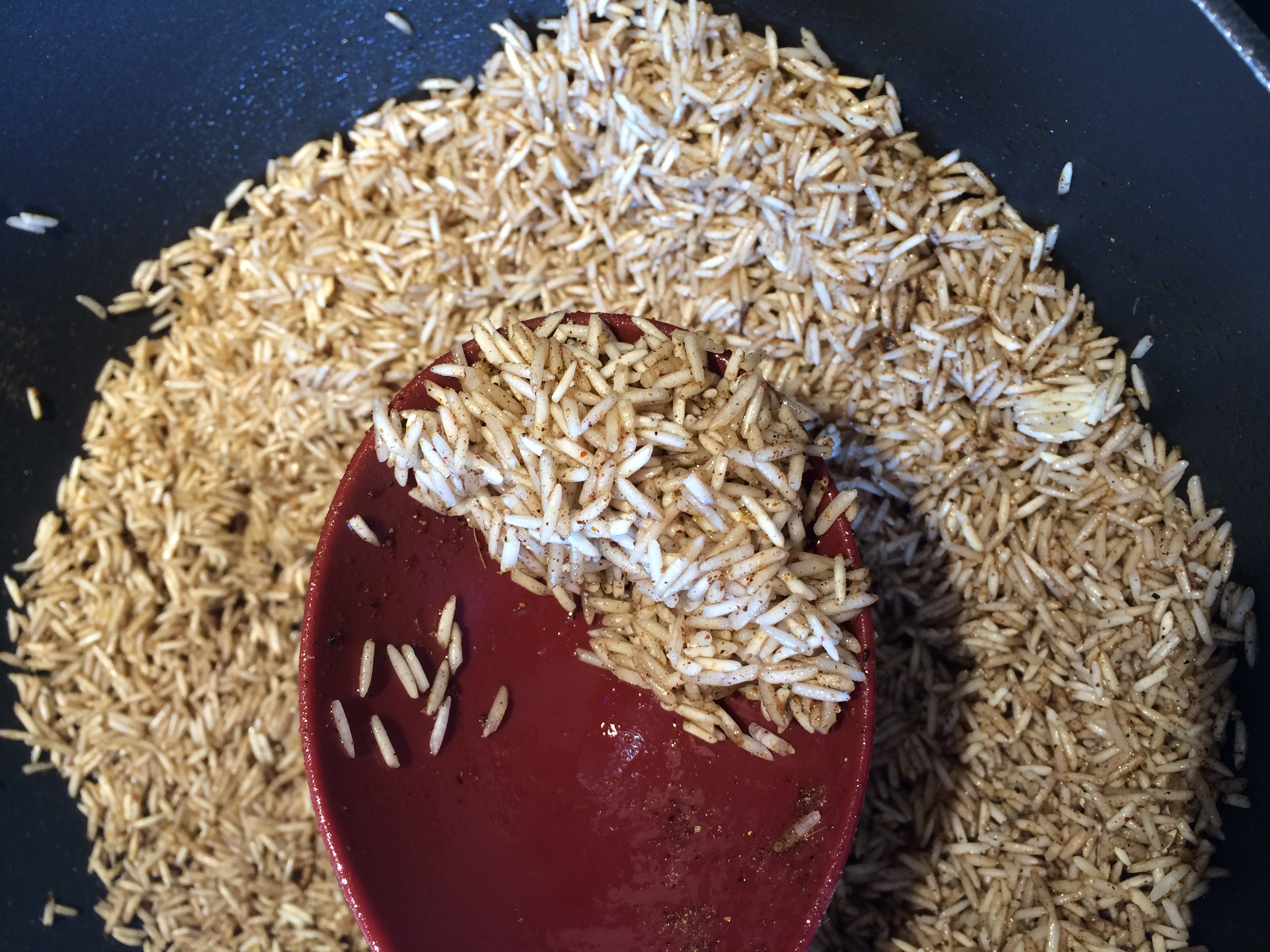 Rice being cooked with baharat