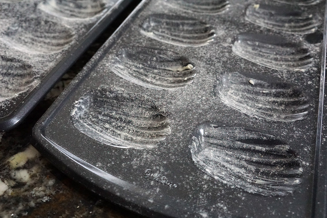 Close up of Butter and lined madeleine pans