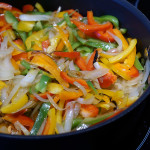 Colored peppers and onions in a pan