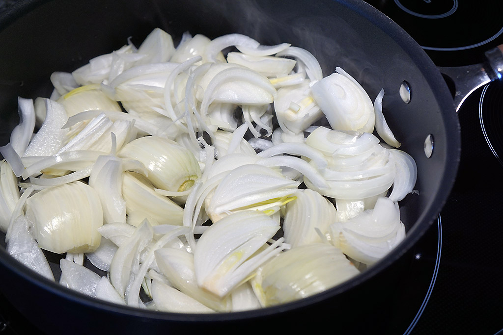 Sliced onions in a pan