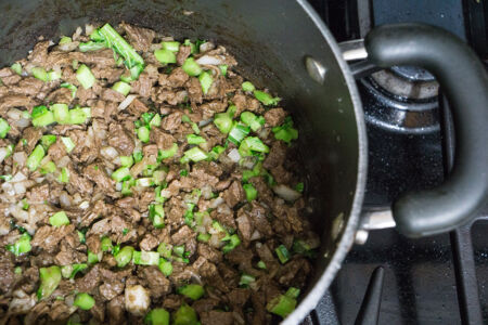 Cooking meat and kale stems Kale Tomato Stew
